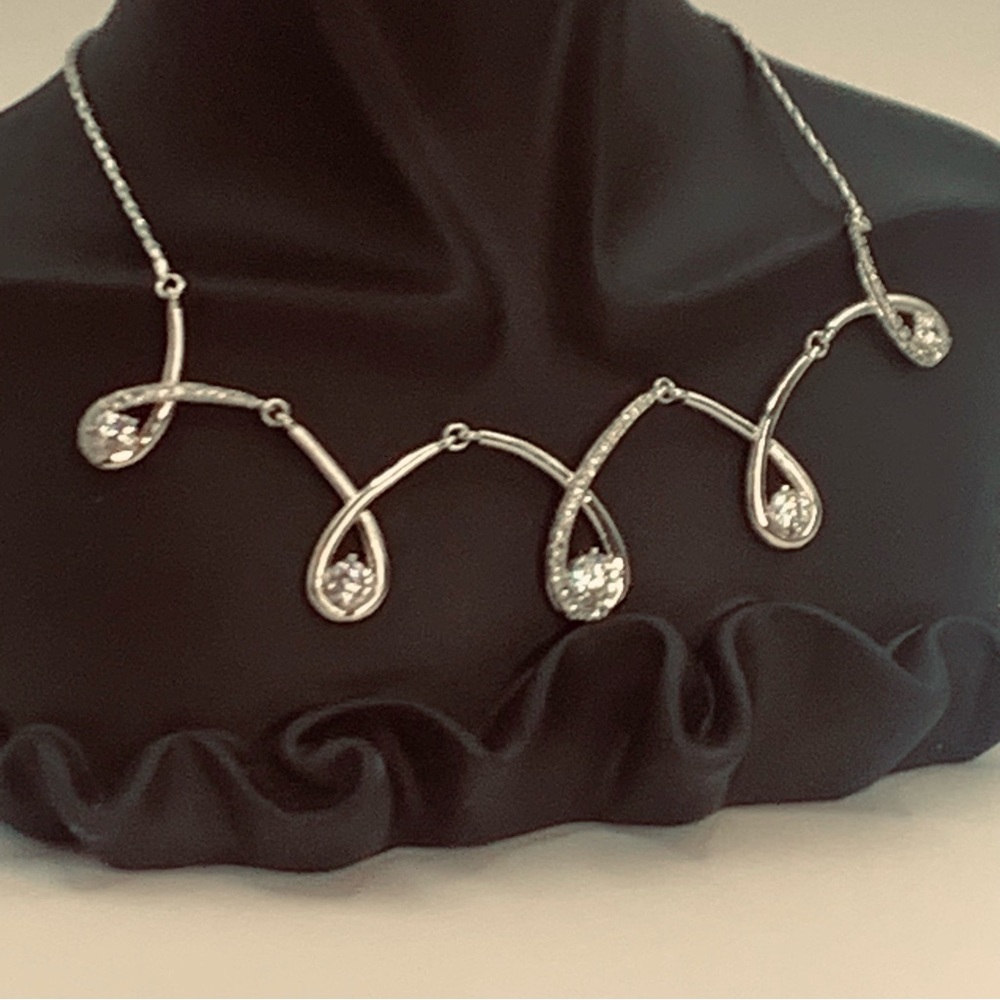 A Silver & Crystal Necklace w/Lobster Clasp
Size 16”